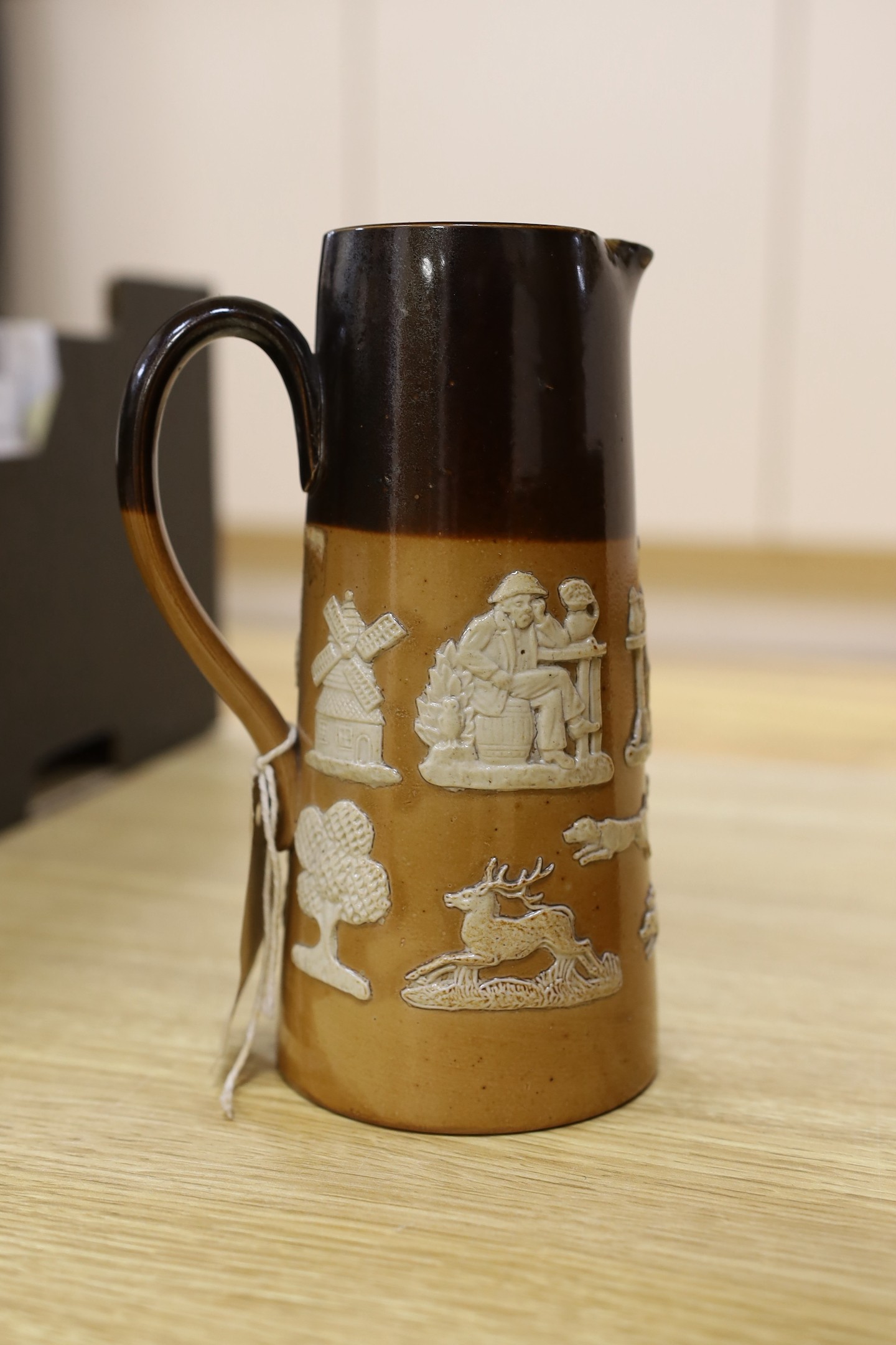 A quantity of Doulton Lambeth stoneware jugs
